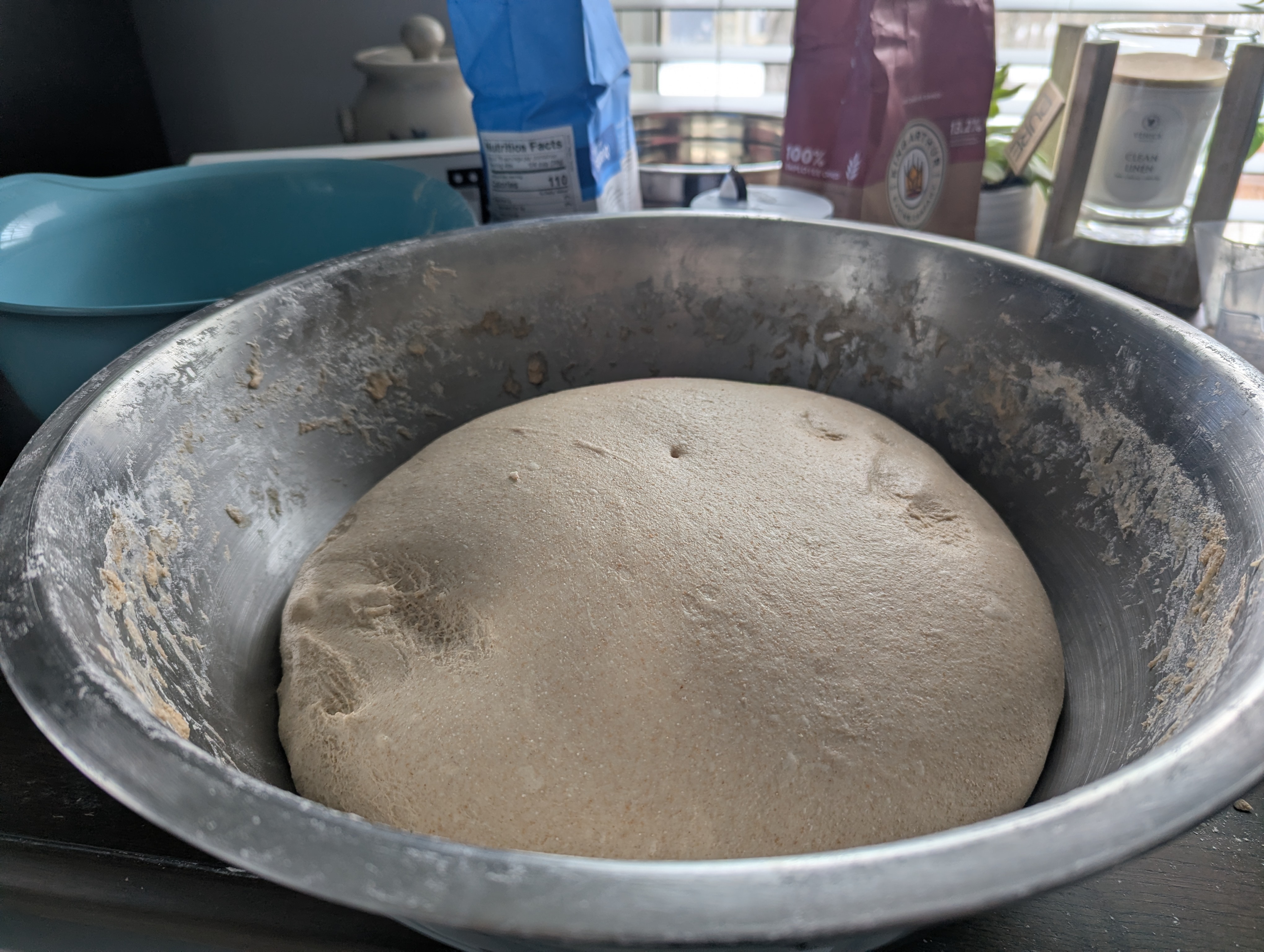 Risen bread dough in mixing bowl